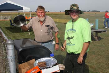 21. Bill DeWitt & Robert Jones cooking food